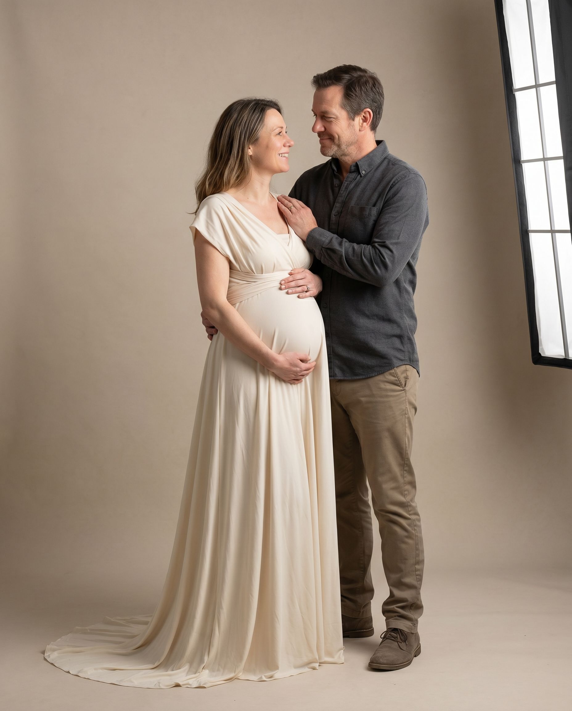 Maternity photoshoot with partner in studio